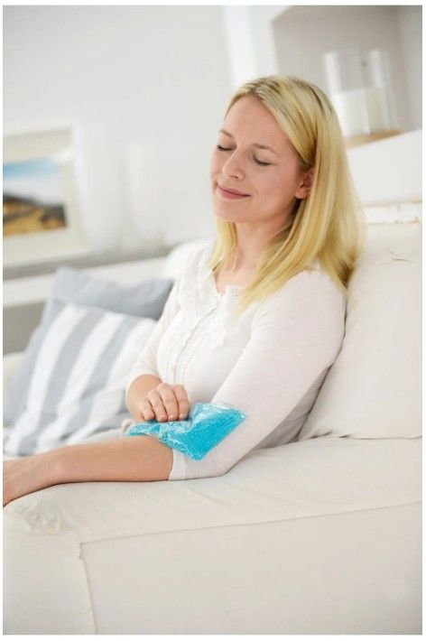 Woman Holding a Sports Pack on Her Elbow