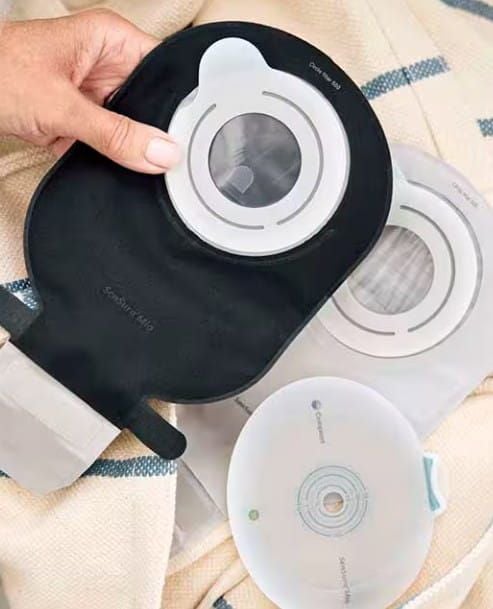 Hand Holding Ostomy Pouch