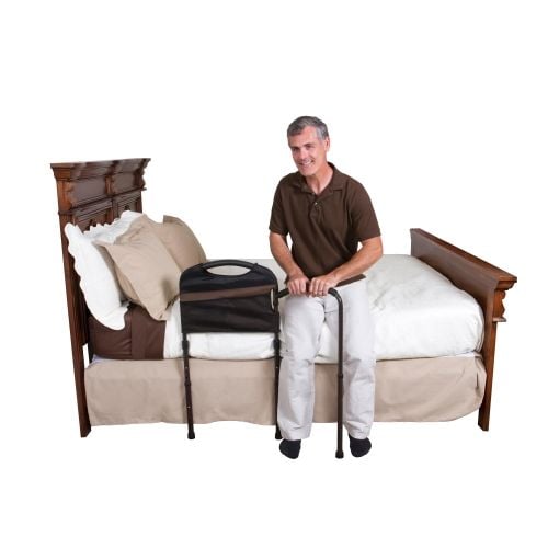 Stander Mobility Bed Rail w/ Man Transitioning to Standing from Bed