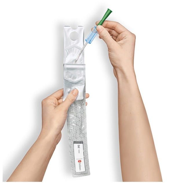 Hands Pulling the Catheter out of Packaging