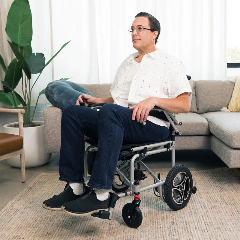 Man sits in wheelchair in living room