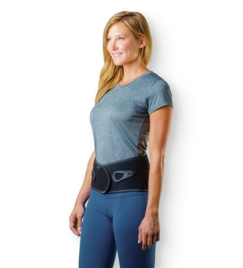 A woman wearing the Aspen Lumbar Belt.