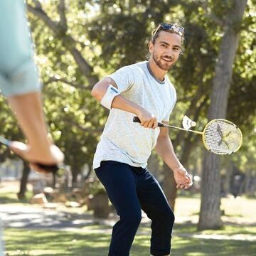 Playing badminton with the elbow strap on