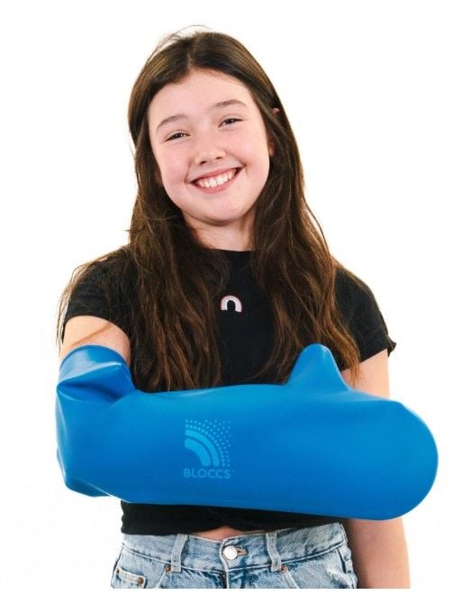 Girl Wearing Large Cast Cover on Right Arm
