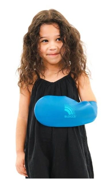 Girl Wearing Small Cast Cover on Left Arm