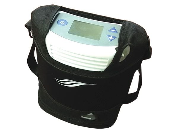 Portable oxygen concentrator in stylish carry bag with padded strap