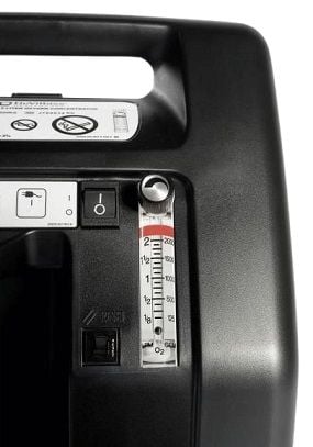 A close-up view of the flow meter valve and on/off switch.