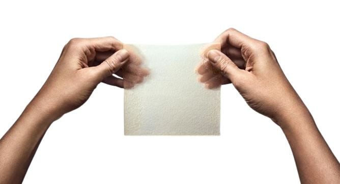 Hands Holding Exufiber Ag+ Dressing