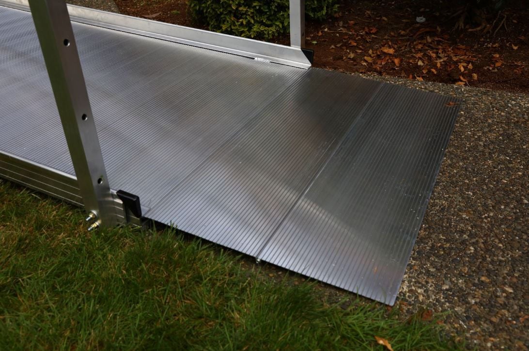 Extruded tread surface of the wheelchair ramp.