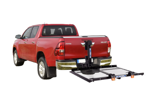 The EZ Carrier Lift mounted on the back of a red Toyota Helix.