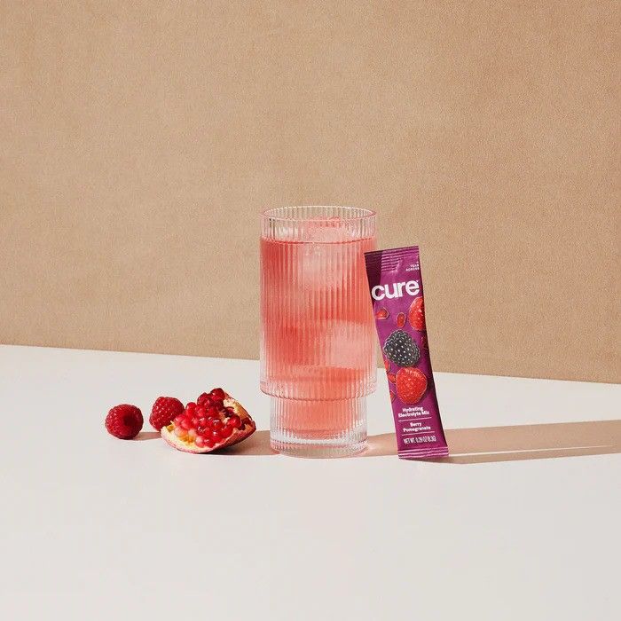 Packet with full glass of Cure hydration