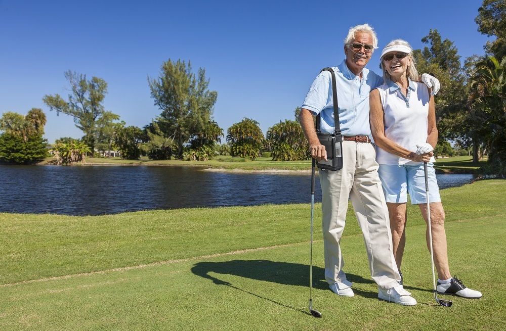 Lifestyle photo of a couple golfing with the man using the G5 inside a carry bag.