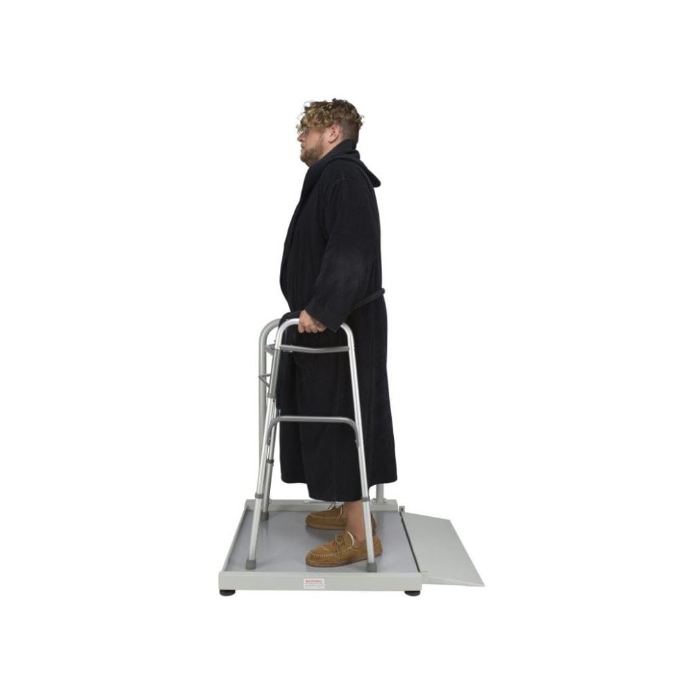A man using the digital wheelchair ramp scale.