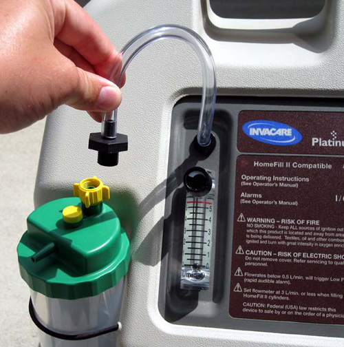 Hand Connecting Adapter to Oxygen Humidifier