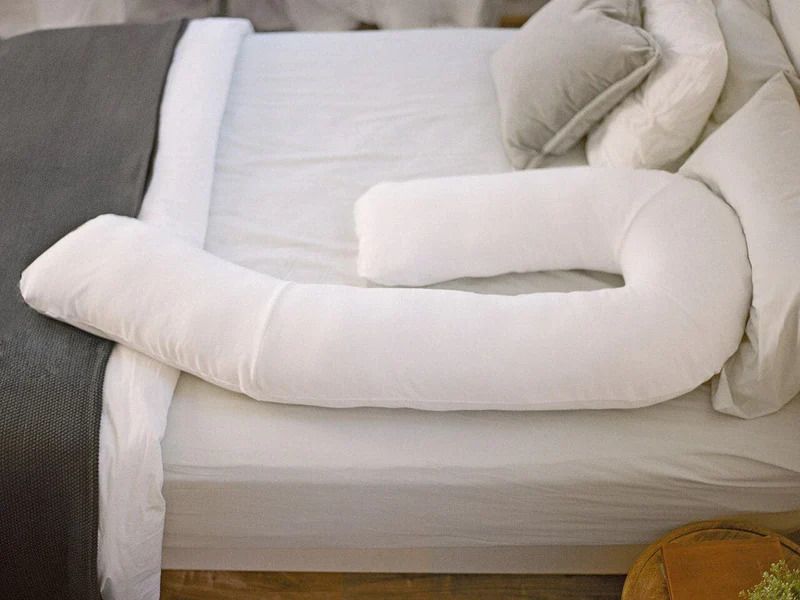 Top view of pillow laid out on a bed