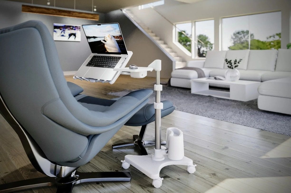 White Laptop Stand Beside Gray Chair