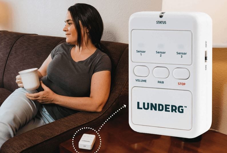 Woman Sitting on a couch Beside a Portable Pager