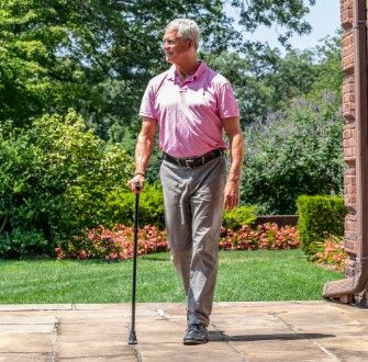 Man walking and using cane