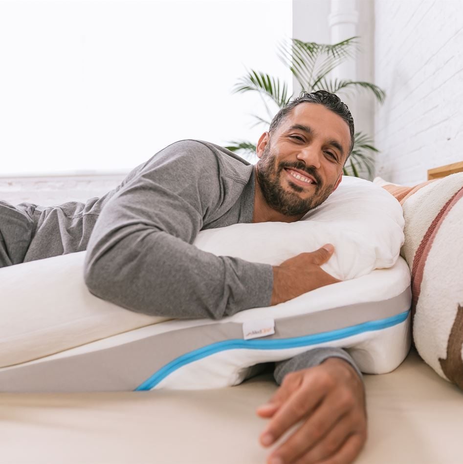 Man Lying on Wedge Pillow