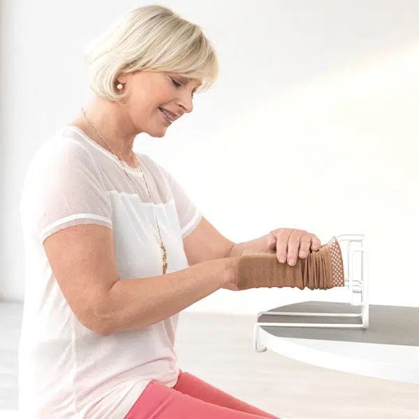 medi Arm Butler - Compression Sleeve Donning Aid in use