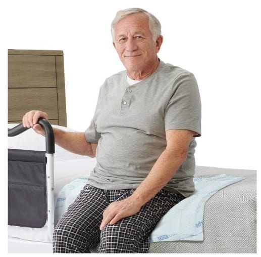 Man Sitting on Underped on Bed
