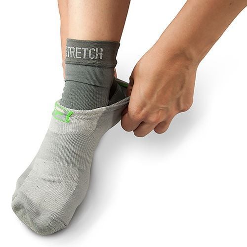 Donning a sock over plantar fasciitis sleeve