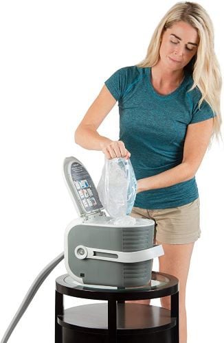 User adds ice to the Cold Rush Therapy Machine