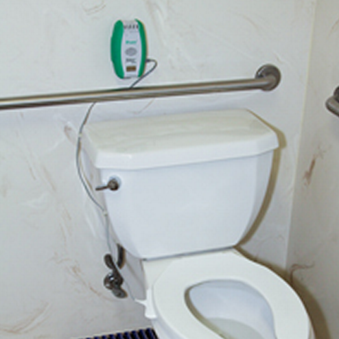 Sitter Elite Fall Monitor Alarm Mounted on Bathroom Wall