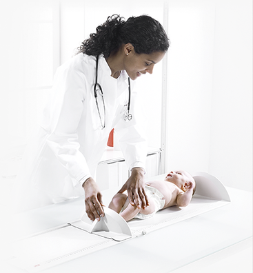 Pediatrician Measuring Baby on the Table.