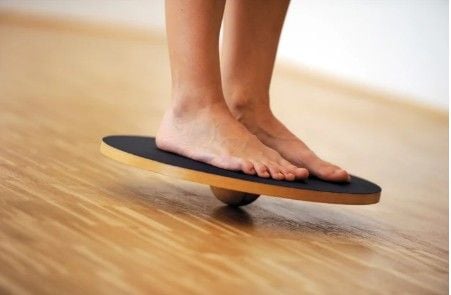Someone standing on Dynamic Balance Board