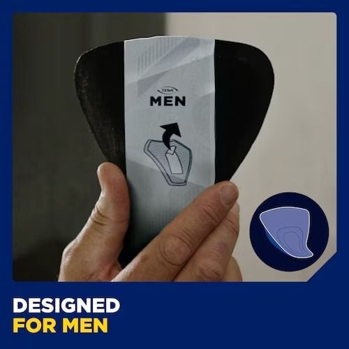 Man's hand holding up TENA pad