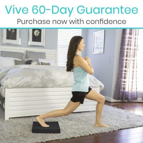 Woman stretches with her back foot on the balance pad