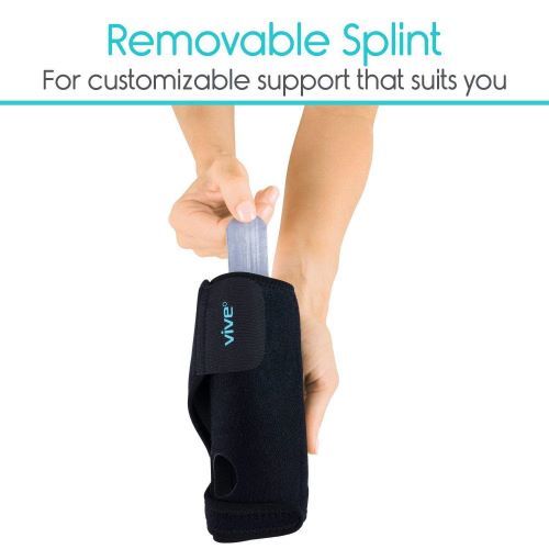 Someone removing the splint from the Vive Wrist Brace.