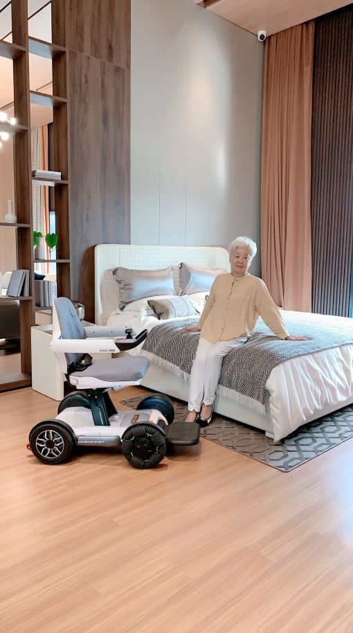 Rebooter X40 Wheelchair Next to Bed.