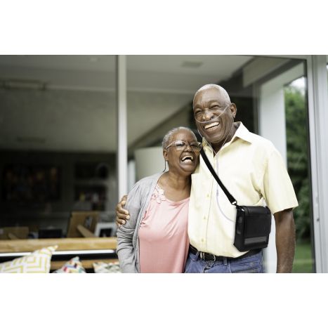 Couple with Man Strapped with the G5 in an Inogen Carry Bag
