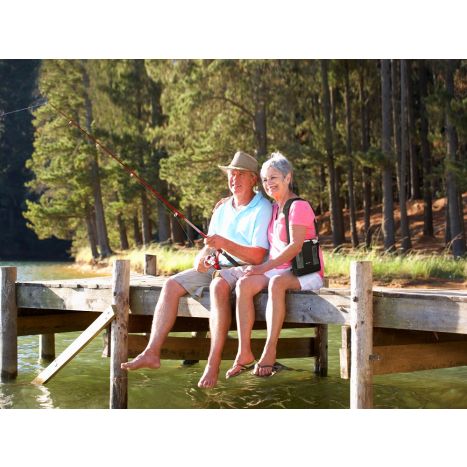 Lifestyle photo of a couple fishing at the pier with the woman with the G5 inside carry bag