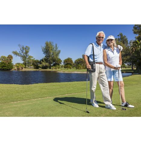 Lifestyle photo of a couple golfing with the man using the G5 inside a carry bag.
