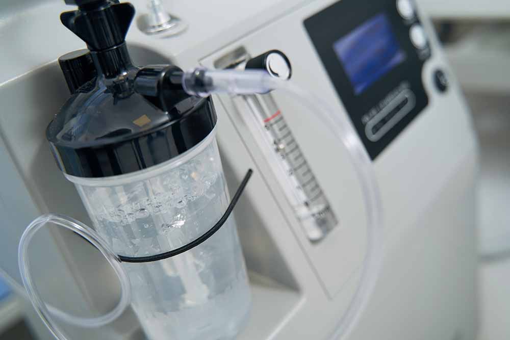 Humidified Bottle Connected to Oxygen Concentrator Via Oxygen Tubing