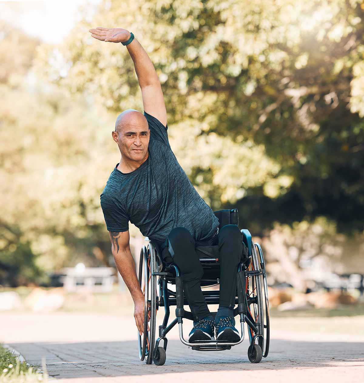 Man stretching in a wheelchair