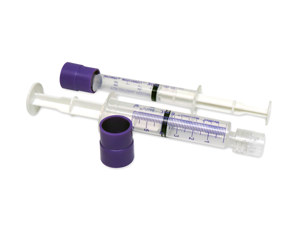 A capped syringe and a syringe with the cap next to it.