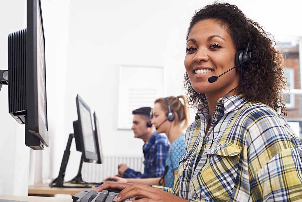 Friendly woman in customer service wearing a headset