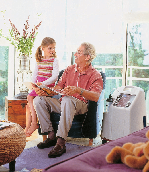 Man reading to a young child to demonstrate its quiet operation