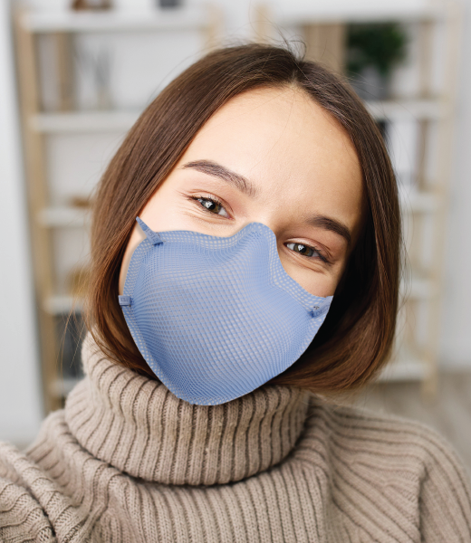 Woman wearing her comfortable Moldex N95 mask.