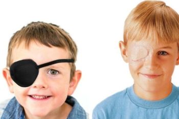 Young Boy Wearing Eye Patch With Headband, Left and Young Boy Wearing Eye Bandage, Right