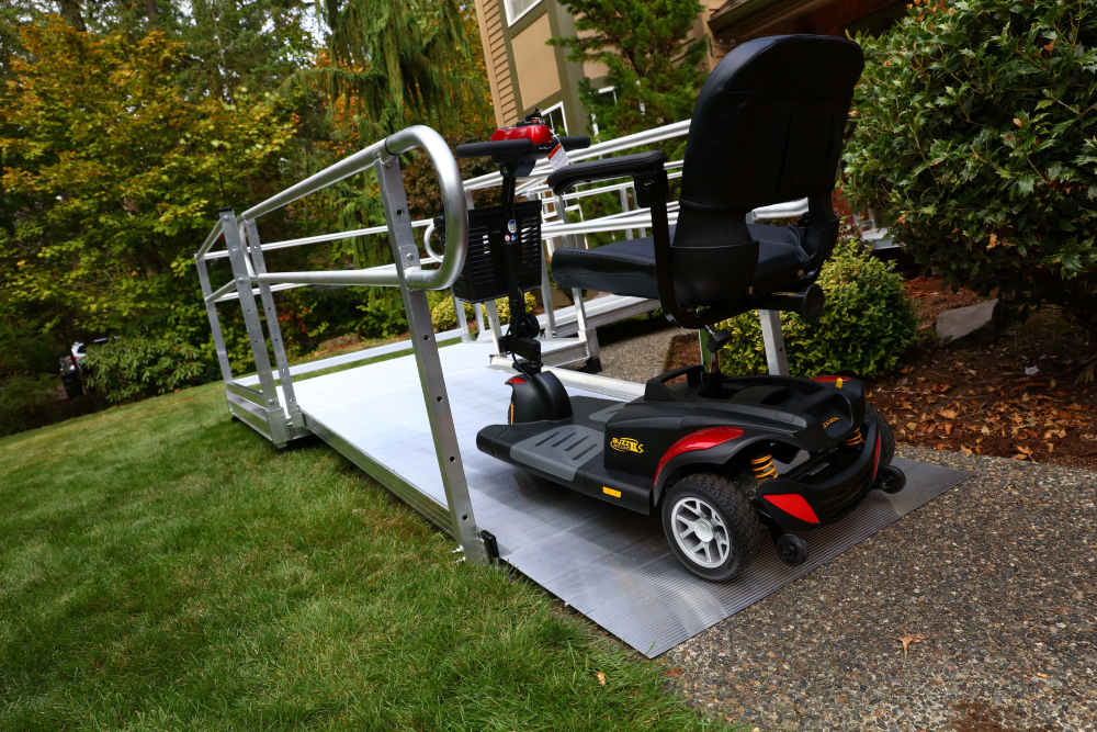 A mobility scooter is positioned on the EZ-ACCESS ramp