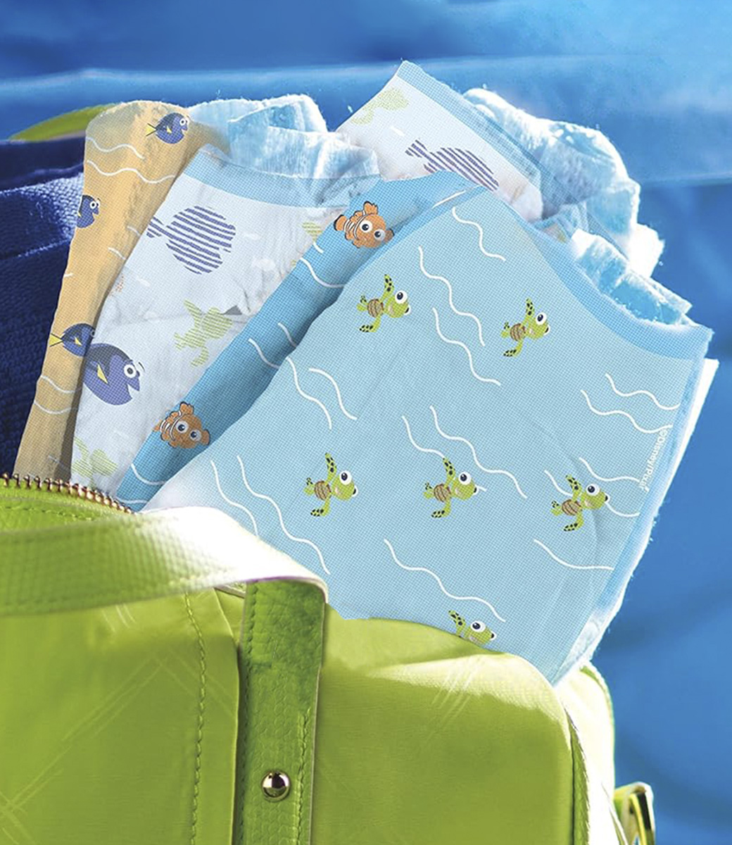 A bag with Little Swimmers diapers with different character prints.