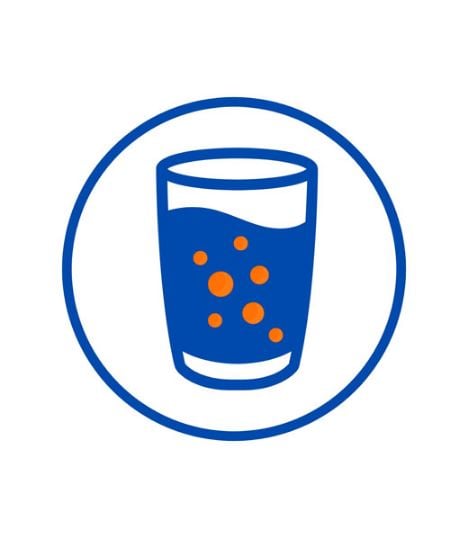Glass With Orange Bubbles Mixed With Blue Liquid