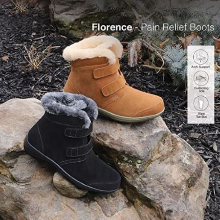 A black Florence boot and a camel Florence boot atop a rock