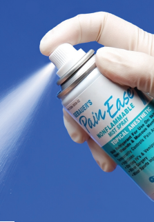 data-element= Someone wearing nitrile gloves spraying the Pain Ease Spray.