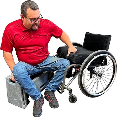 A man using the ResQUp to get into his wheelchair. 